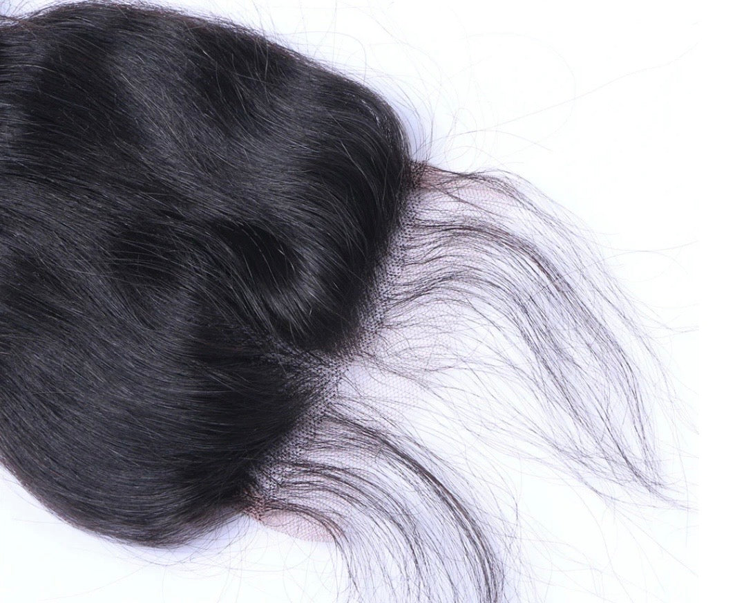 Close-up of 4x4 lace closure showing fine transparent lace construction and natural straight hair texture in natural black 1B, Fridalicious virgin human hair